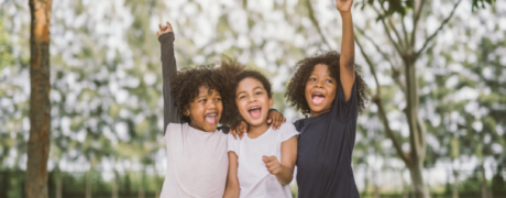 children playing happily in a yard