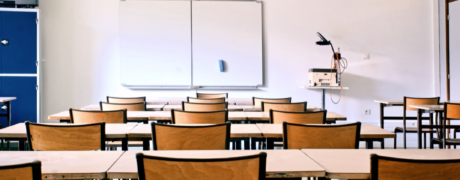 a classroom filled with empty desks