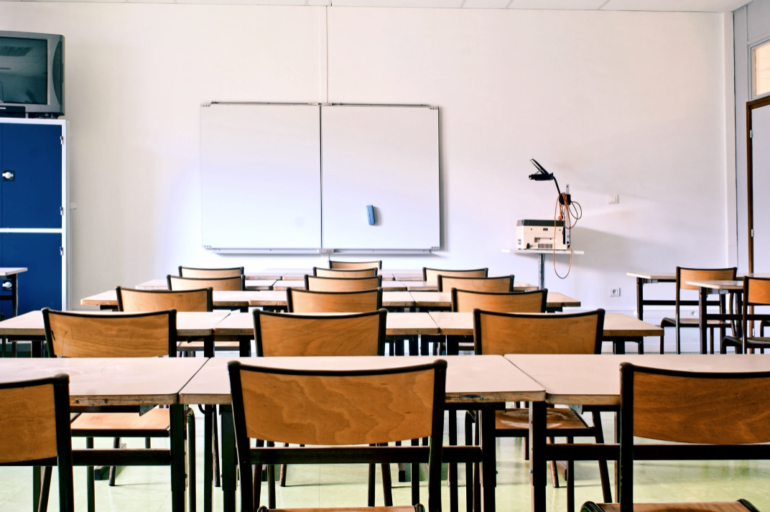 a classroom filled with empty desks